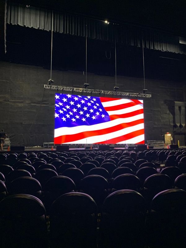 LED video wall glowing behind a live performance
