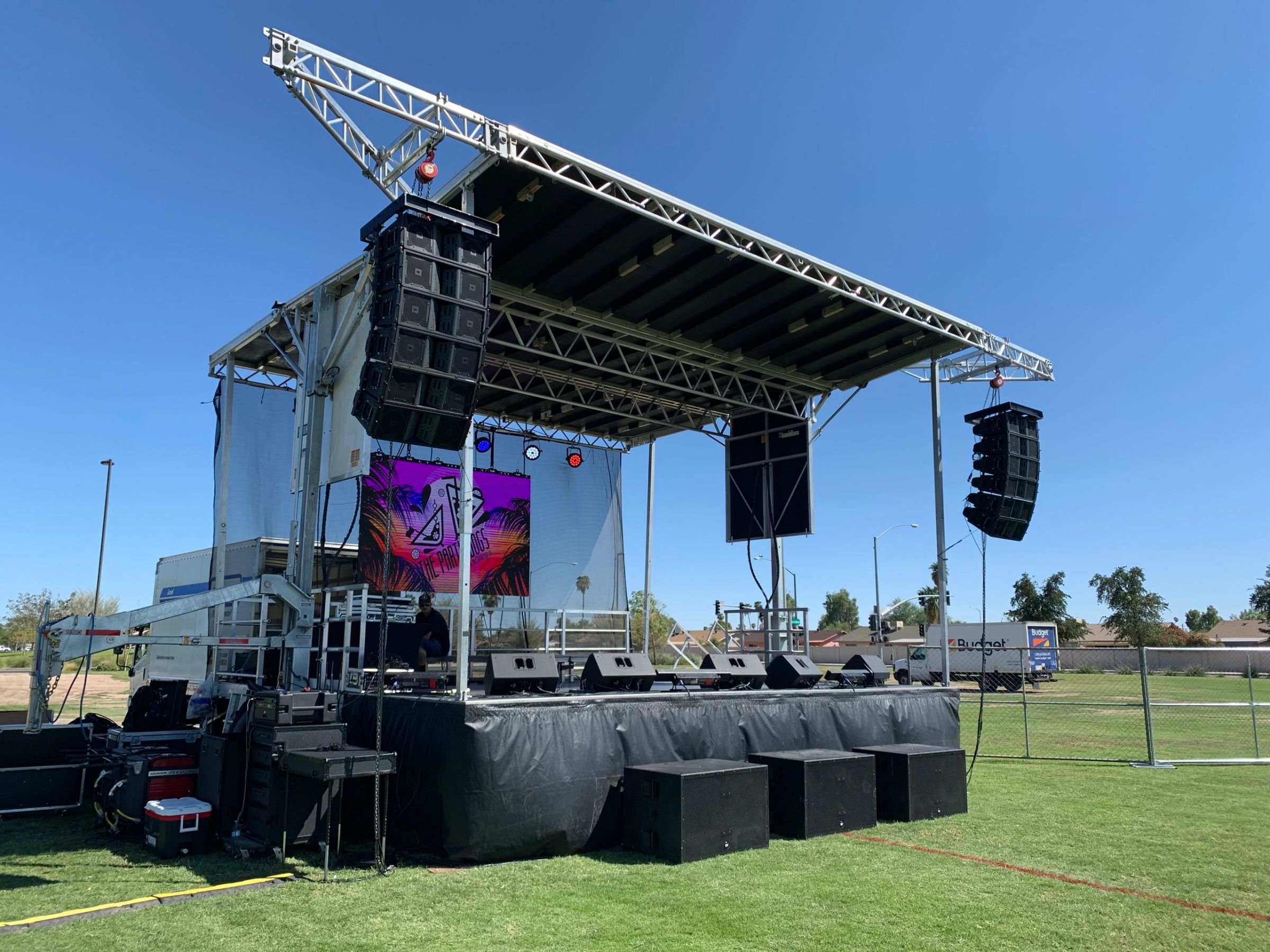 Liven Productions stage with lighting rig and LED video wall at a live event