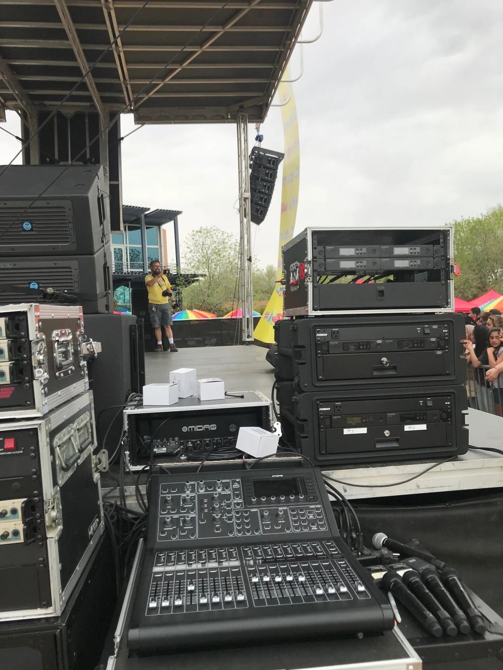 Event production setup with speakers and lighting truss